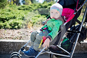 Cute Toddler in pram on a walk