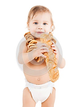 Cute todler eating long bread