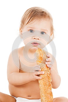 Cute todler eating long bread