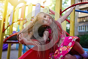 Cute trendy girl with pink dyed hairstyle on her long hair