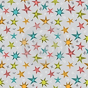 Cute tribal seamless pattern with hand drawn stars for kids. Texture for fabric or wrapping paper. Trendy background in scandinavi