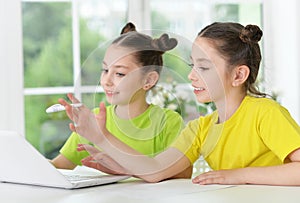 Cute tweenie girls with laptop