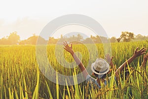 cute two girl happy open arm freedom at rice field