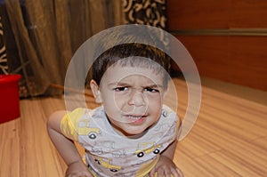 Cute two years old boy making funny faces early development concept, portrait, face expressions