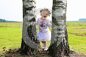 Cute Ukrainian girl playing in the nature