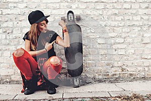 Cute urban girl with skateboard