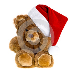 Cute vintage teddy bear with red santa hat