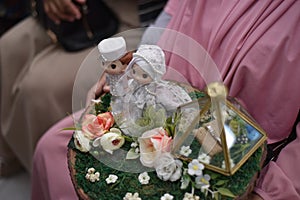 A cute wedding dowry with a Muslim bridal doll on it.