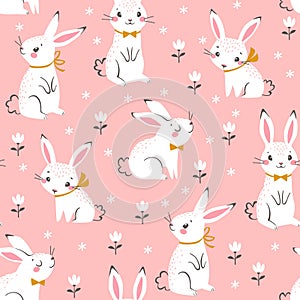 Cute white bunnies pattern on pink background photo