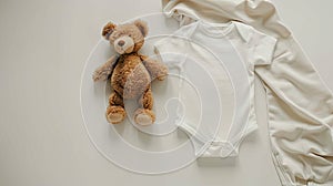 a cute white onesie mock-up set against a pristine white background, adorned with a cuddly teddy bear for added