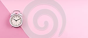 Cute white retro clock on pastel pink duotone drop