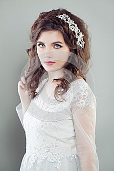Cute woman bride in white bridal dress.