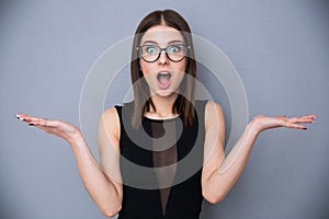 Cute woman with facial expression of surprise