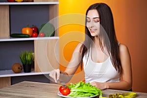 Cute woman with fresh vegetables and fruits leading a healthy lifestyle