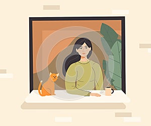 Cute woman with her cat looking out of open window and drinking hot drink