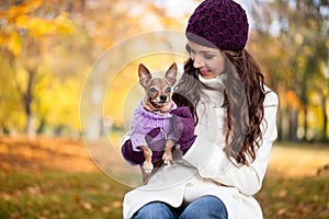 Cute woman with her Miniature Pinscher