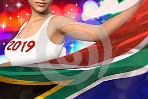 Cute woman holds South Africa flag in front on the party lights - Christmas and 2019 New Year flag concept 3d illustration