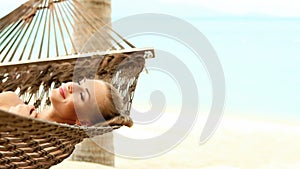 Cute woman laying on hammock