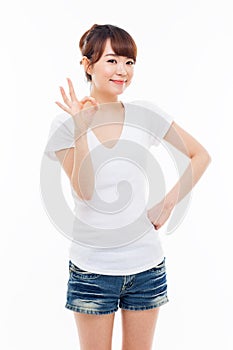 Cute woman with okay hand gesture