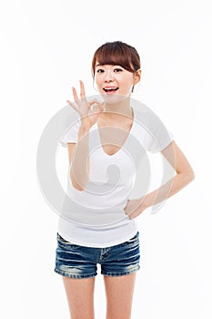 Cute woman with okay hand gesture