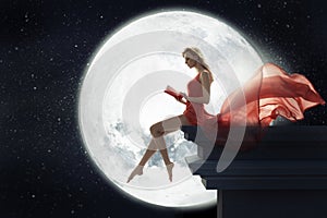 Cute woman over full moon background