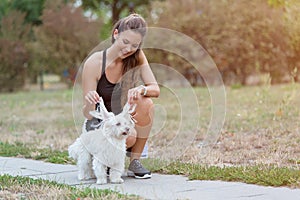 Cute woman play with her dog