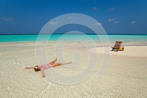 Cute woman relaxing on the tropical beach
