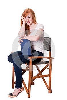 Cute woman seated with book