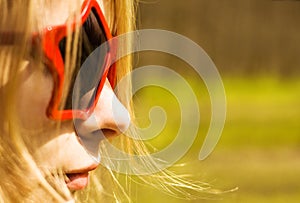 Cute woman in star-shaped sun glasses