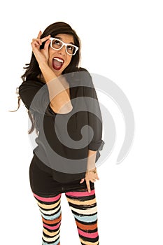 Cute woman wearing funky white glasses and colorful leggings