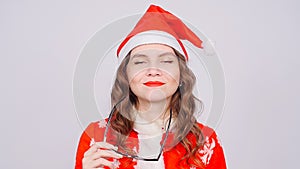 Cute Woman wearing Santa Claus hat and glasses