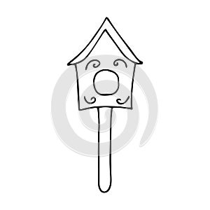 Cute wooden birdhouse. Wooden building for the care