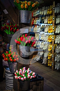 Cute wooden shoes and wooden tulips in souvenir shop, Netherlands
