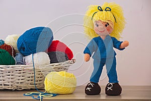 Cute wool dolls are lying on the table