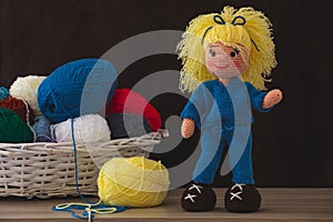 Cute wool dolls are lying on the table