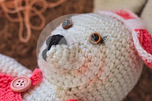 Cute wool dolls are lying on the table