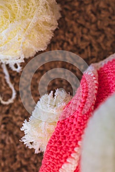 Cute wool dolls are lying on the table