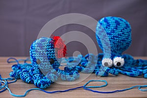 Cute wool dolls are lying on the table