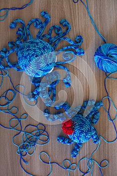 Cute wool dolls are lying on the table