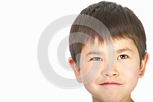 Cute young asian boy with a mischievous look photo