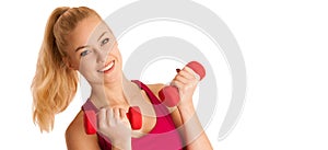 Cute young blond woman working out in fitness gym isolated over