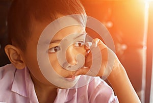 Cute young boy doing homework