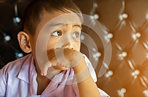 Cute young boy doing homework