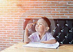 Cute young boy doing homework