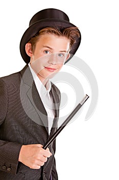 Cute young boy dressed as a magician