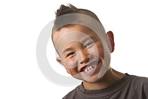 Cute young boy with funny mohawk haircut isolated