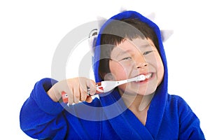 Cute young boy with great smile brushing teeth