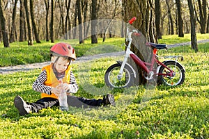 Cute young boy out riding on his bicycle