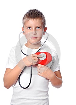 Cute young boy playing doctor photo