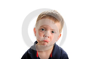 Cute young boy pouting